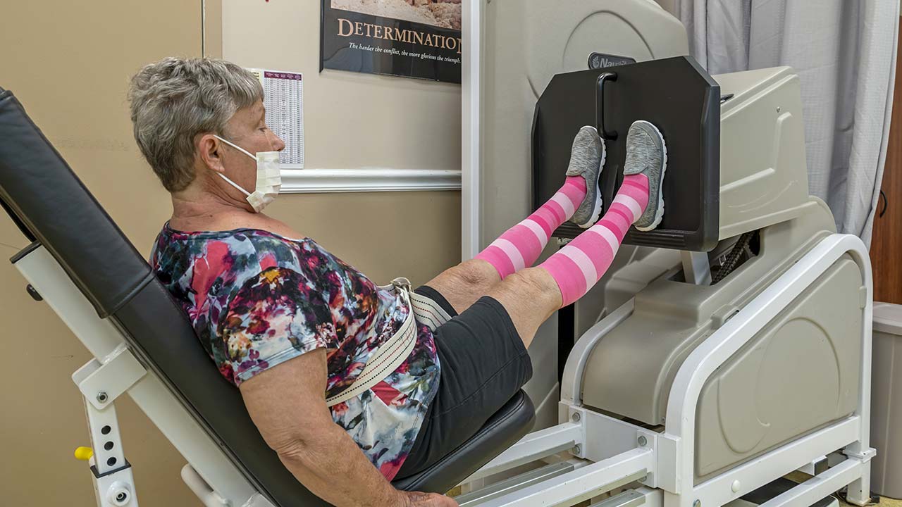 Mattoon resident exercising on leg press machine