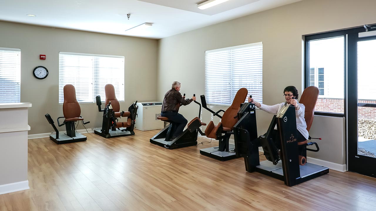 Stratford Commons Rehab resident patients working out on weight machines