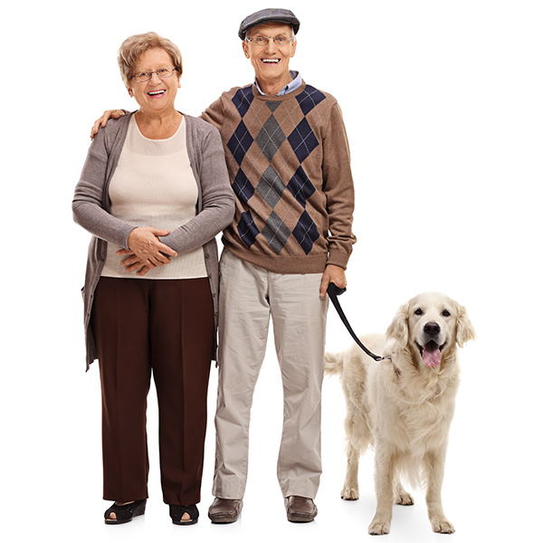 Senior couple with their dog on a leash