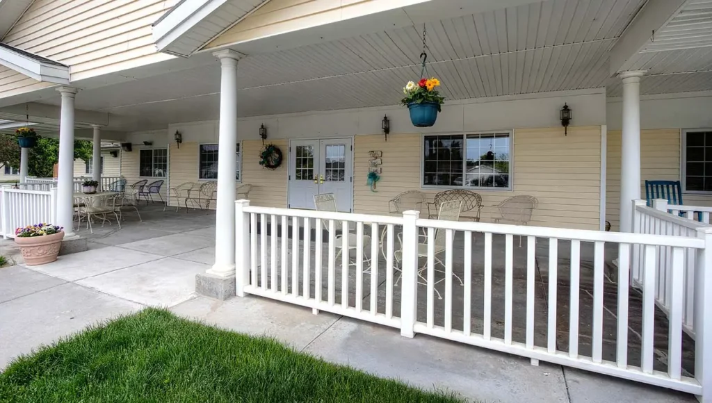 Cottonwood Senior Living front entrance with large covered porch with seating