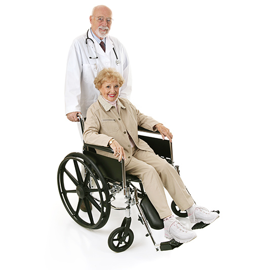 Dr standing next to female senior in wheelchair