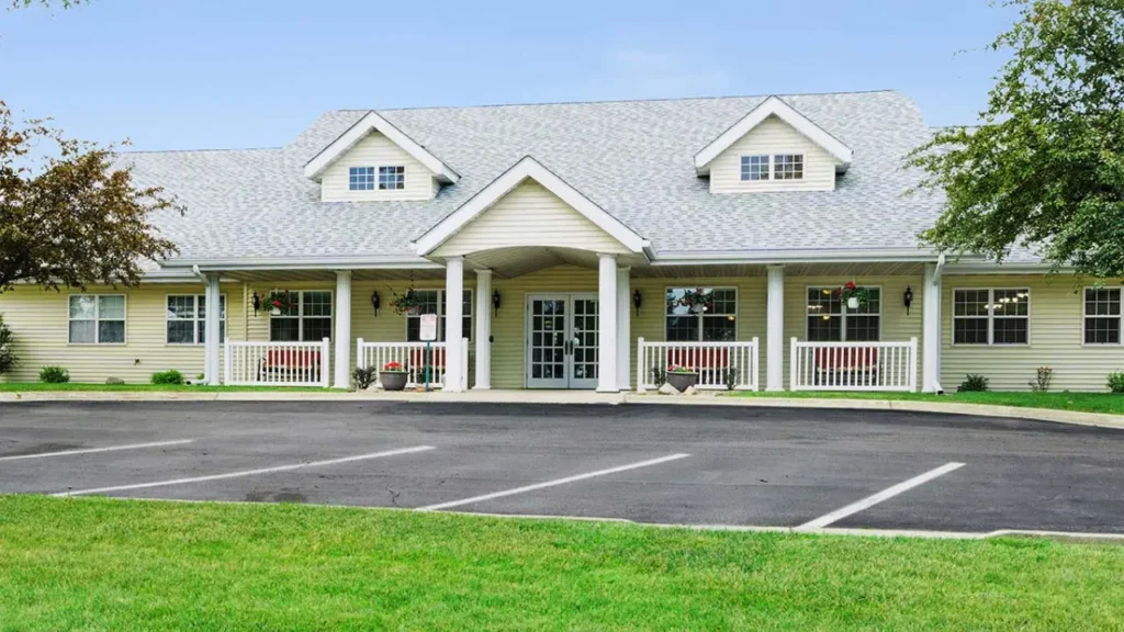 Modern single-story assisted living building with a grey roof at Rolling Meadows Senior Living in Carroll, IA, Carroll County.