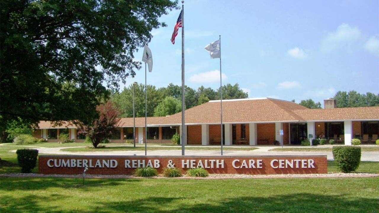 Image of a brick building with a sign reading 