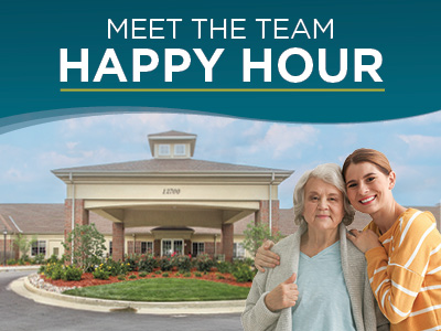 Two women, one elderly and one younger, stand smiling in front of a building with the text “Meet the Team Happy Hour” above them. The setting suggests a welcoming community or care facility.