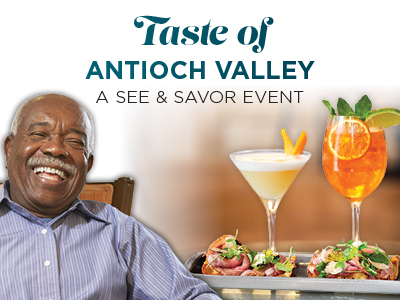 A smiling man sits beside a tray with cocktails and appetizers. Text above reads: