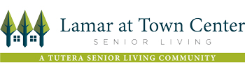Logo for Lamar at Town Center Senior Living. It features three stylized green trees with white house icons embedded in them, followed by the text "Lamar at Town Center Senior Living" and "A Tutera Senior Living Community" on a green banner.