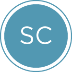 A circular logo with a blue background features the white, capitalized letters "SC" in the center. The circle is outlined with a thin white border.