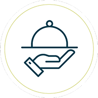 Simple line drawing of a hand holding a covered food platter, resembling a serving tray with a dome lid, enclosed within a thin circular border.