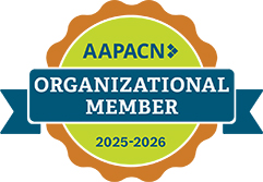 A badge with a blue ribbon reading "AAPACN Organizational Member 2025-2026" on a green and orange circular background.
