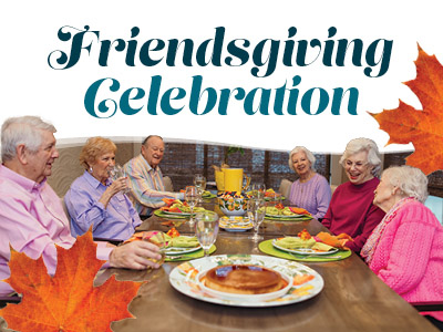 Six older adults sit around a festive dinner table, smiling and enjoying a meal together. The text above reads 
