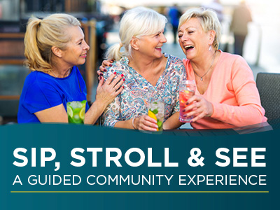Three smiling older women sit together outdoors, holding colorful drinks and laughing. Text below reads: