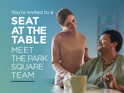 Two women sit together and smile warmly. Text reads: