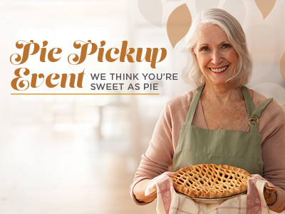 A smiling woman holding a baked lattice-top pie, with text that reads, “Pie Pickup Event, We think you’re sweet as pie.”