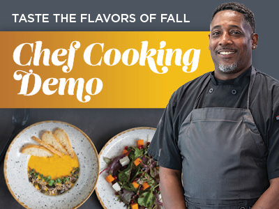 A chef in a black uniform stands smiling beside two plated dishes. Text reads, “Taste the Flavors of Fall: Chef Cooking Demo.”.