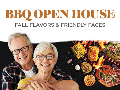 Smiling older couple hugging, with grilled meats and vegetables on a barbecue. Text reads “BBQ Open House—Fall Flavors & Friendly Faces.”.