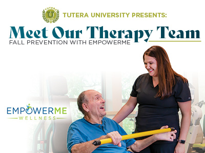 A smiling older man in a blue shirt holds a yellow bar while a female therapist in scrubs stands beside him, both appearing happy. Text reads: “Meet Our Therapy Team: Fall Prevention with EmpowerMe.”.
