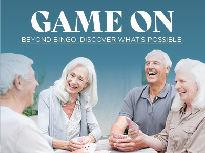 Four older adults sit together, smiling and laughing while playing cards. The text above them reads, “GAME ON. Beyond bingo. Discover what’s possible.”.