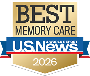 A gold badge reading "Best Memory Care" above a blue, red, and white ribbon that says "U.S. News & World Report 2026.