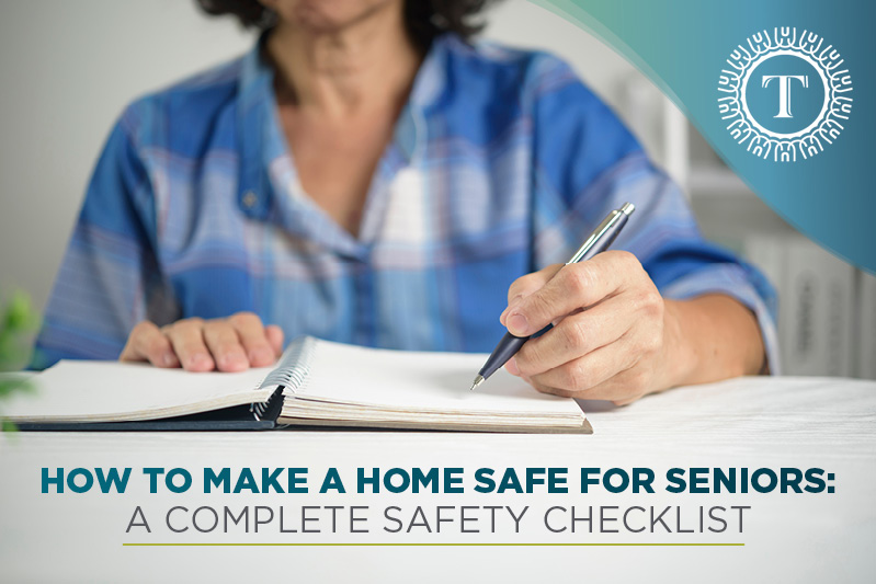 A person writing in a notebook at a table, with text overlay: “How to make a home safe for seniors: A complete safety checklist.” The image highlights important tips on Safety For Seniors.